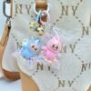 Wholesale Mini Labubu flocked fabric bag/backpack charm, cute keychain/gift charm.