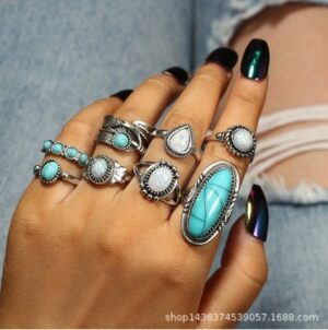 Wholesale Europe and the United States hot cross-border retro inlaid turquoise carved feather ring 8 suit ring jewelry factory direct sales