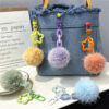 Wholesale Creative cute fur ball small flower key chain small fresh color candy ball plush bag pendant earphone set accessories