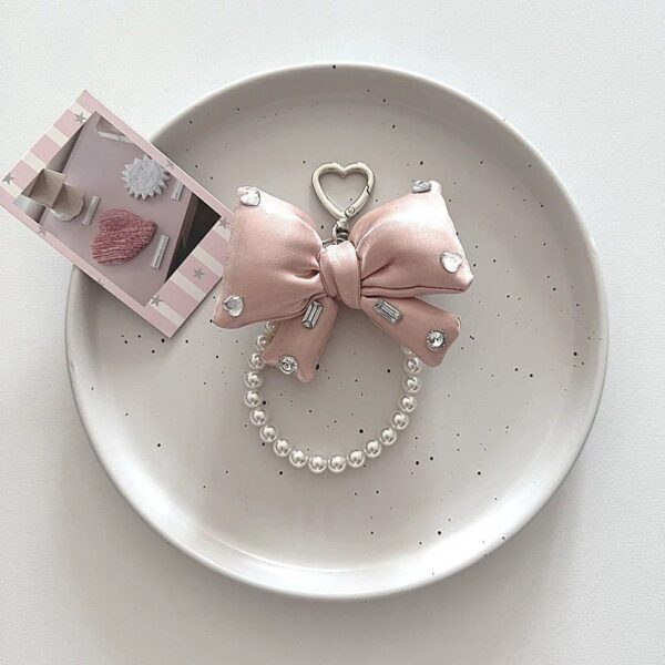 oly-50f44631dd002e427ffee888c47214c3 Wholesale Butterfly Knot Pearl Keychain