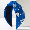 Wholesale Korean style elegant fabric headband studded with pearls, round evil eye design, fashionable wide-brimmed knotted hair accessory for women.