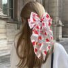 Wholesale Cross-border best-selling Christmas hair accessories, Santa hats, mesh bows, spring clips, snowman hair clips, holiday gift headwear.