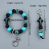 oly-57c42a88df77cb184bcf8263e5e47f25 Wholesale Cross Silicone Leopard Print Wooden Bead Keychain