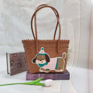 Brown shoulder basket with pink striped dog