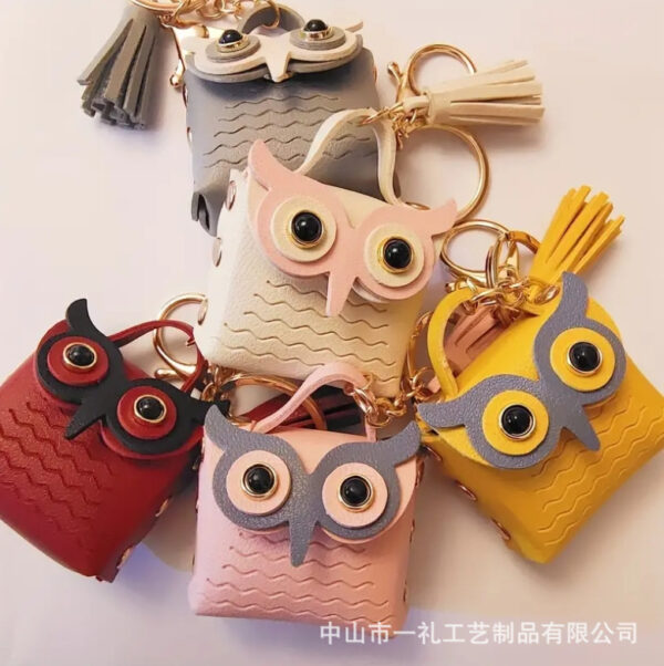 oly-5a42a75d2ee272e143aef07ff67e14ee Wholesale New Pu Leather Owl Coin Purse Cute Cartoon Bluetooth Headset Bag Fashion Tassel Car Key Pendant