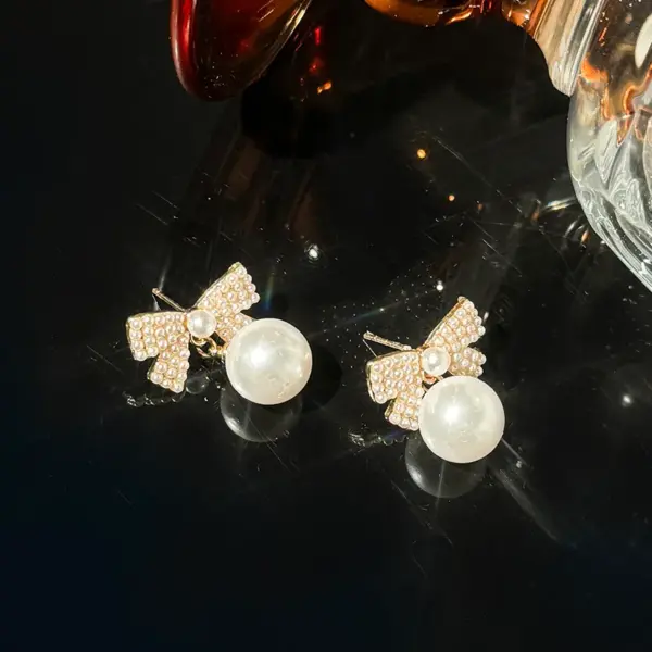 Wholesale 1 Pair Elegant Glam Bow Knot Inlay Alloy Artificial Pearls Drop Earrings