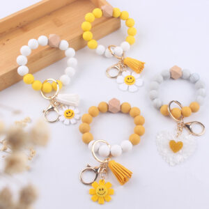 Wholesale New Cartoon sunflower love keychain pendant handmade beaded tassel silicone bracelet wrist keychain