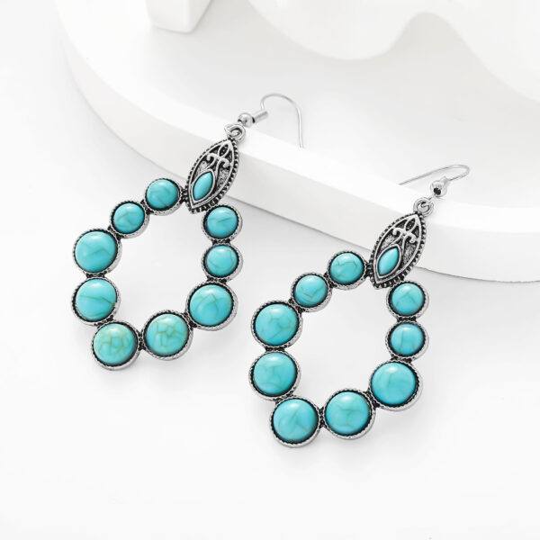 oly-5ad211a42f86ed9862ef81bf7b0cd62c Wholesale European and American New Retro Earrings Bohemian Turquoise Drop-Shaped Cut Out Earrings Earrings Factory Direct Sale