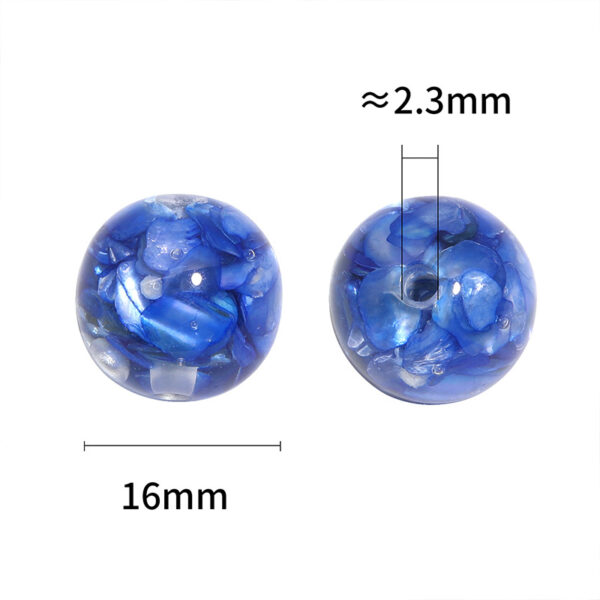 oly-5edef7e92f7c2bf64ee76d1c4e4c3910 Wholesale Irregularly shaped, vibrant mother-of-pearl inlaid with translucent, perforated beads.