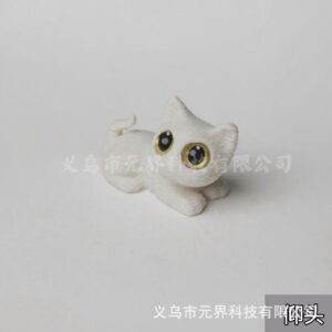 White cat - lying on its side, looking up