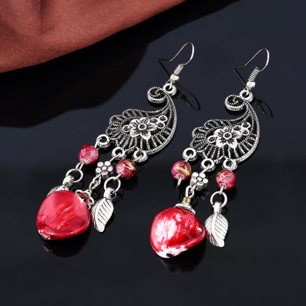 Wholesale European and American fashion retro hollow carved leaves tassel earrings new big-name temperament National style earrings