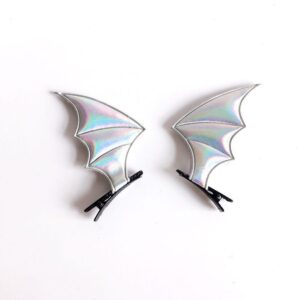 A pair of silver devil wings hair clips
