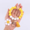 Wholesale New Cartoon sunflower love keychain pendant handmade beaded tassel silicone bracelet wrist keychain