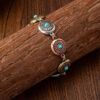 Wholesale Turquoise embellished vintage flower cross alloy bracelet