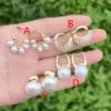 Wholesale 1 Pair/Package Casual Modern Style C Shape Round Oval Polishing Inlay Copper Acrylic Pearl 18K Gold Plated Earrings Ear Studs