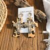 oly-68e6539038d2db5fc894a793922b2ab5 Wholesale Western-style leather leopard print cross earrings