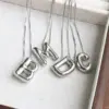 Wholesale Simple Style Classic Style Letter Copper Silver Plated Pendant Necklace In Bulk