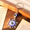 Wholesale Cross-border Explosions Devil's Eye Blue Eyes Keychain Retro Compass Moon Snowflake Pendant Backpack Pendant Accessories