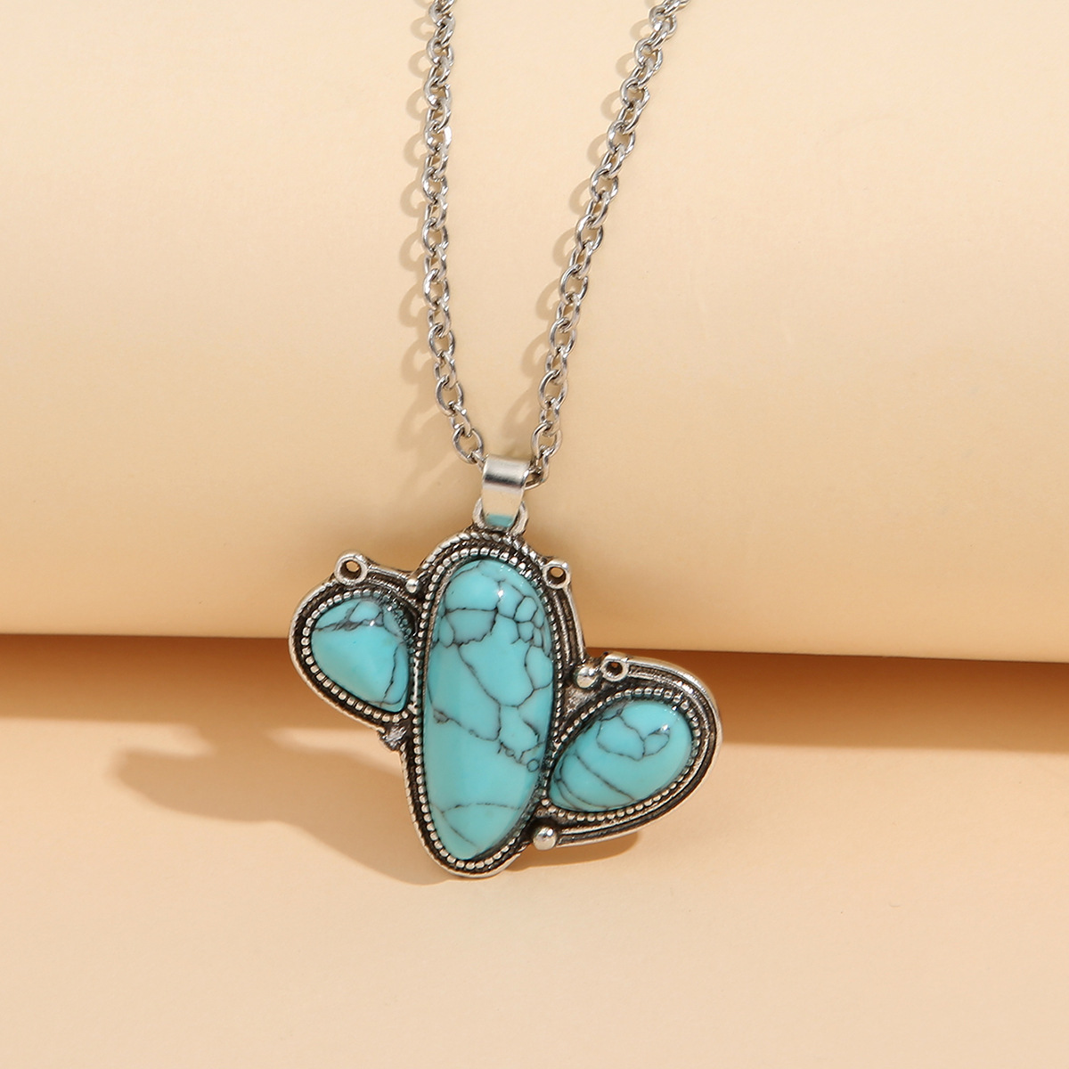 Wholesale AliExpress Europe and the United States retro shaped cactus loose stone pendant Western Wind cross-border carved clavicle chain
