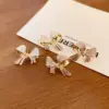 Wholesale Fashion Butterfly Bow Knot Copper Inlaid Zircon Artificial Pearls Earrings 1 Pair