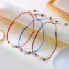 oly-6dcc364dc7244d205ce3d4904708f10b Wholesale Fashion Holiday Beach Style Multicolor Shell Wooden Beads Woven Necklace Mix and Match Adjustable Handmade Woven Jewelry
