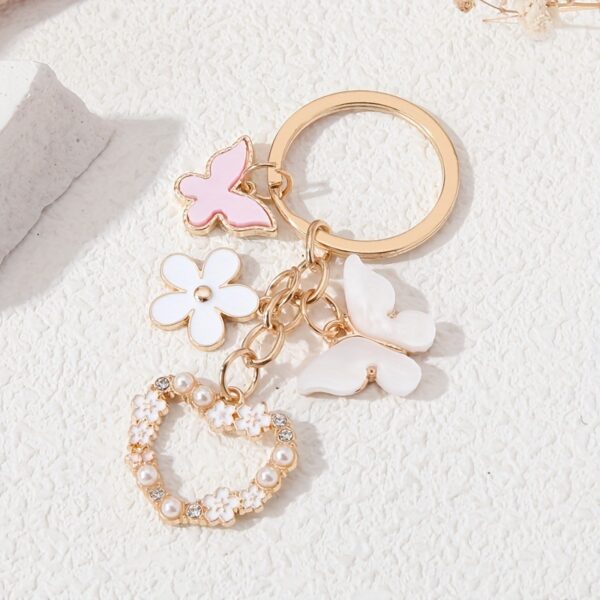 oly-73568a0f37ec3391551b8afe2e409967 Wholesale butterfly flower alloy key chain pendant love diamond cute small white flower pendant key chain aessories