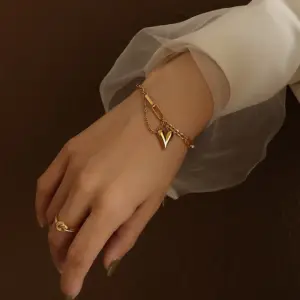 569 Peach Heart Gold Bracelet with Tassel 15 5cm