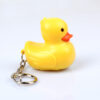 Wholesale In stock cute cartoon duck car keychain LED luminous sound creative electronic toy small gift bag ornaments