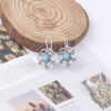 Wholesale Hollow petal inlaid turquoise drop earrings