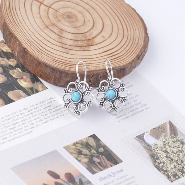 Wholesale Hollow petal inlaid turquoise drop earrings