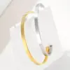 Wholesale 304 Stainless Steel Stainless Steel Solid Color PVD Coated 18K Gold Plated Elegant Retro Plating Hollow Out Rose Gold Gold Silver Bangle