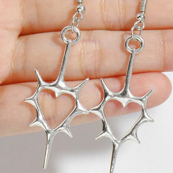 oly-77e35cd5ebdc38e6e0b63deacc66003b Wholesale Hollow spiny heart earrings Y2K punk hollow spiny heart headphones