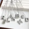 Wholesale Simple Style Classic Style Letter Copper Silver Plated Pendant Necklace In Bulk