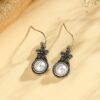 oly-7f695e541bc03fb540fe5c0165670ccd Wholesale Vintage sier-plated flower earrings inlaid with pearls