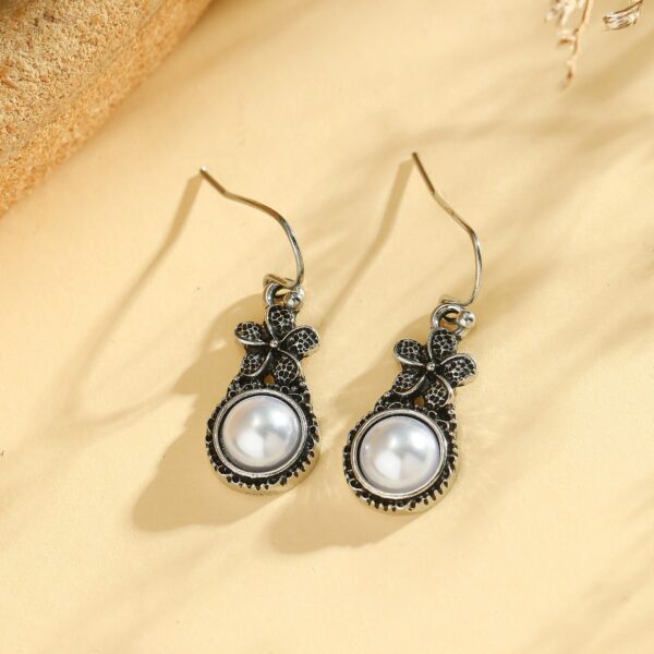oly-7f695e541bc03fb540fe5c0165670ccd Wholesale Vintage sier-plated flower earrings inlaid with pearls