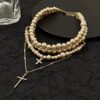 oly-81049ab9a5c37c29eb907250754d96f6 Wholesale Diamond-embedded multi-layer Pearl cross pendant necklace for women Japanese and Korean style light luxury sweater chain personality Fashion necklace fashion