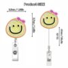 oly-82f55be2e47959c4bf8efe8ecdd31fb8 Wholesale New acrylic smiley face flower cute mini quicksand rocking retractable rotating badge clip easy pull buckle