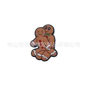 Two gingerbread man beads