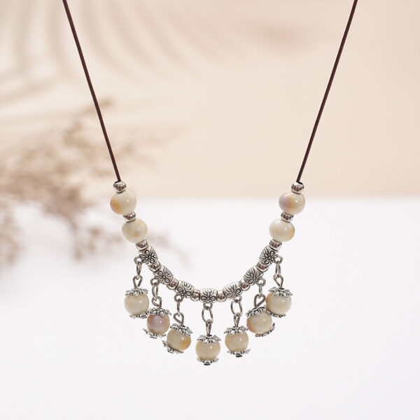 oly-893fa7137243f754a457e8d0a5c83ba0 Wholesale vintage national style ceramic necklace women's long sweater chain small jewelry aessories manufacturers
