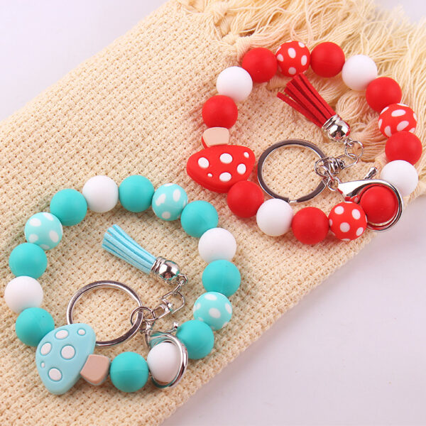 Wholesale New wrist keychain pendant leather PU short tassel mushroom silicone beaded bracelet key ring accessories