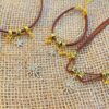 oly-8b120d9d7851e812494222df8f7ddf7f Wholesale Women's eight-inted star brown leather necklace