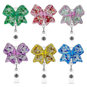oly-8ea64f16842fdcab67aa328119e2c19f Wholesale Acrylic pink bow retractable name tag Badge Reels