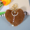 Wholesale Autumn and winter love fur ball pearl keychain peach heart bag pendant car accessories plush pendant small gifts