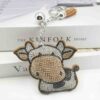 oly-909d84a1474a3d01894a821c4c649018 Wholesale 4pcs Creative Cartoon Diamond-encrusted Cow Keychain