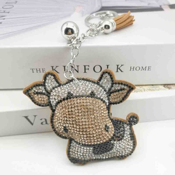 oly-909d84a1474a3d01894a821c4c649018 Wholesale 4pcs Creative Cartoon Diamond-encrusted Cow Keychain