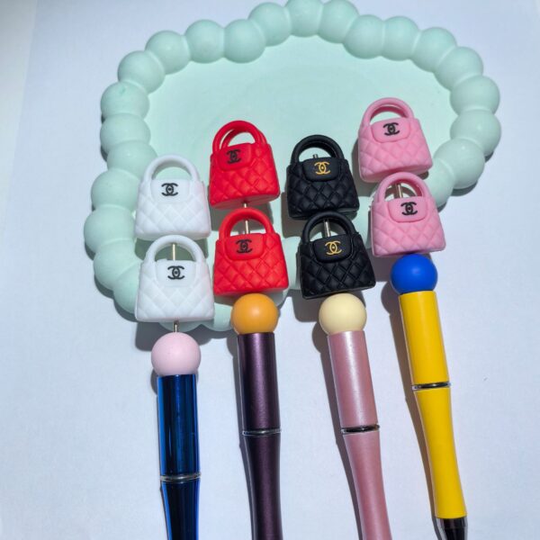 oly-910bd285ffc16c785b446cd53ee13e3f Wholesale Cute small bag silicone cartoon beads