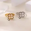Wholesale Luxurious Vintage Large Imitation Pearl Women's Ring 18K Gold Plated Four-Leaf Clover Rotating Heart Blue Zircon Jewelry Ring