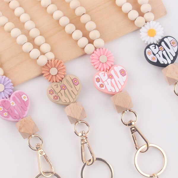 oly-945d2bbc4064ba4ff5cbf69c41afe6a0 Wholesale New Wooden Bead Necklace Keychain Cartoon Silicone Daisy Beaded Pendant Bracelet Keychain Accessories