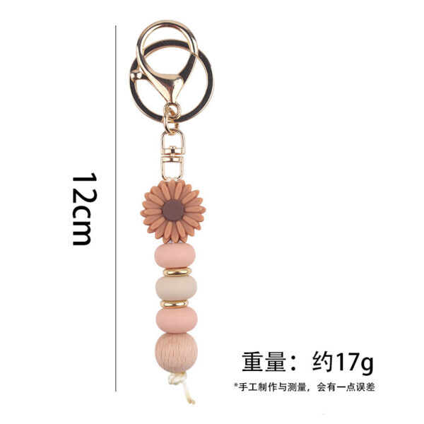 Wholesale New creative DIY cartoon daisy small tooth glue pendant handmade silicone beaded bag pendant keychain