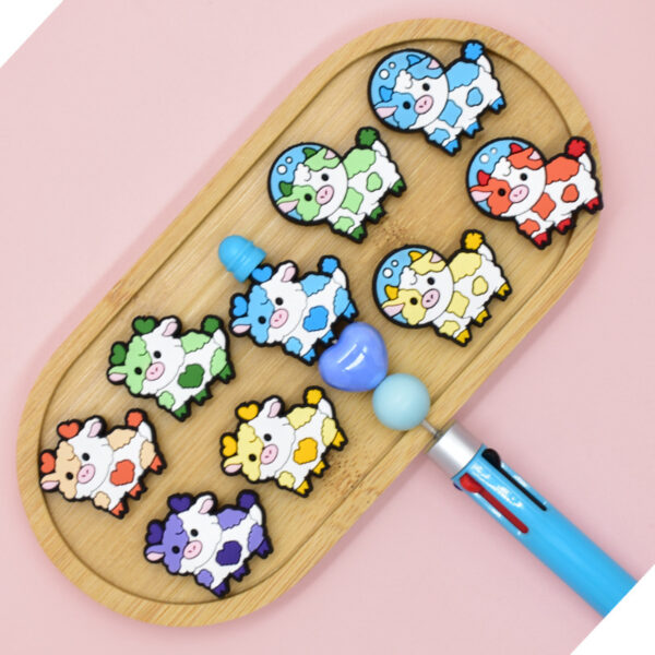 oly-979254a0d86ee643deee6abc1a491ae4 Wholesale Random 100pcs Cow and Yak Pen Beads PVC Beads